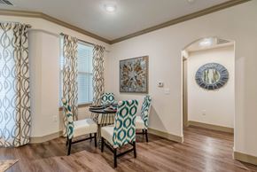 Carrollton apartment for rent - A dining room with a table and chairs. at Atlas Point at Prestonwood Apartments , Carrollton