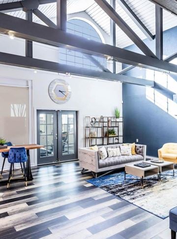 Irving apartment for rent - A living room with a grey couch and a wooden table.