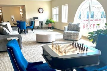 Tinley Park apartment for rent - A chess board is set up on a table in a living room.