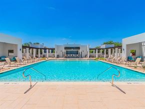 Fort Worth apartment for rent - A large swimming pool with a clear blue sky above. at The Spring at Silverton Apartments, Fort Worth, TX