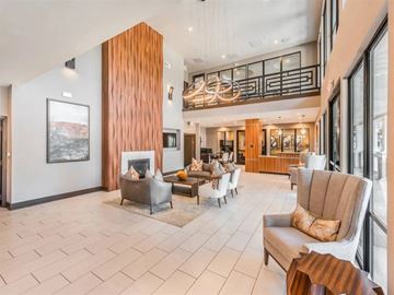 Lewisville apartment for rent - A living room with a fireplace and a painting on the wall.