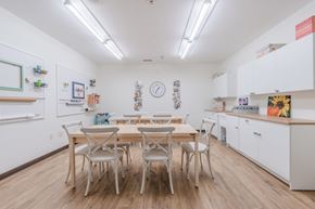 Utica apartment for rent - Community kitchen with dining table and chairs at Schuyler Commons Apartments, Utica, 13502