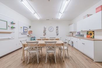 Community craft room with workspace and storage