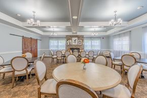 Utica apartment for rent - Community dining room with fireplace and tables at Schuyler Commons Apartments, Utica, 13502