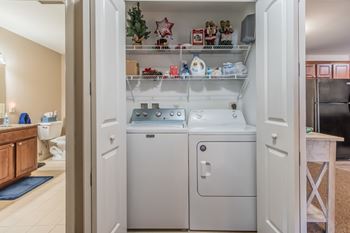 In unit laundry with storage shelving