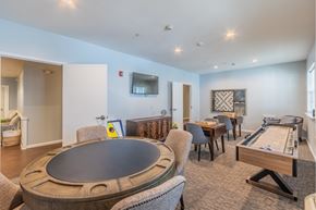 Glenmont apartment for rent - Game room with poker table and shuffleboard at Glenmont Abbey Village, 55+ Apartments, New Jersey, 12077