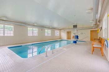 Indoor swimming pool with seating area
