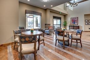 Reno apartment for rent - Community dining area with round tables at Mountain Lakes Estates Apartments, Reno, NV 89521