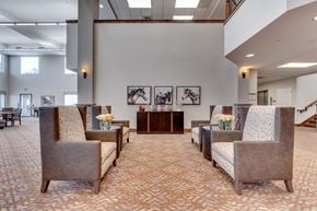 Reno apartment for rent - Modern lobby with horse artwork and seating at Mountain Lakes Estates Apartments, Reno, 89521
