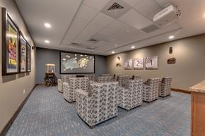 Reno apartment for rent - Theater room with stadium seating and projector at Mountain Lakes Estates Apartments, Reno, Nevada