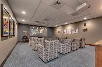Home theater with patterned recliners and projector