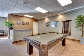 Reno apartment for rent - Recreation room with pool table and cue rack at Mountain Lakes Estates Apartments, Nevada