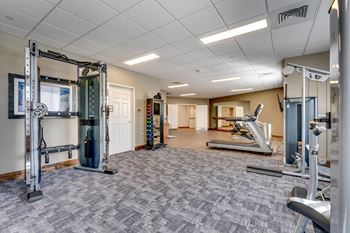 Fitness center with cable machines and cardio equipment
