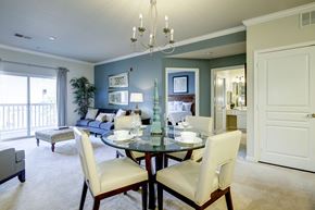 Ellicott City apartment for rent - Open concept dining and living room with blue accent wall at Regency Crest Apartments, Ellicott City, 21043