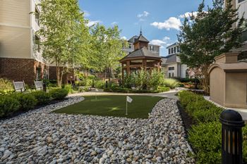 Putting green with river rock and gazebo
