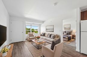 Faribault apartment for rent - A living room with a couch, chairs, and a coffee table.