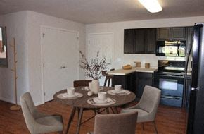 Rochester apartment for rent - a kitchen and dining room with a table and chairs