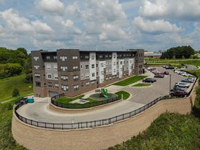 Rochester apartment for rent - an aerial view of an apartment building with a parking lot