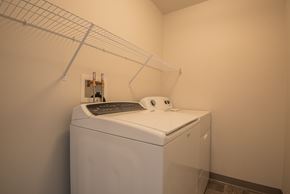 Mankato apartment for rent - A white washing machine in a laundry room.