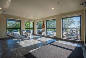 Eagan apartment for rent - A sunny day in a spacious living room with a balcony.