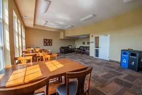 Forest Lake apartment for rent - A conference room with a long table and chairs.