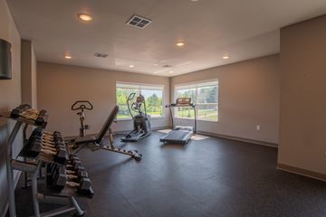 Vadnais Heights apartment for rent - A spacious home gym with a variety of equipment.