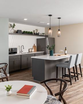 Maple Grove apartment for rent - an open kitchen and dining area with a table and chairs