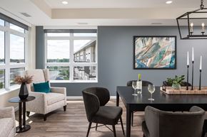 Maple Grove apartment for rent - a dining room with a table and chairs and a large window