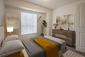 Rochester apartment for rent - a bedroom with a bed and a dresser and a window