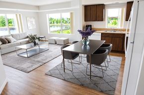 Mankato apartment for rent - A modern dining room with a glass table and chairs.