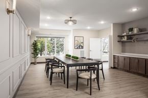 Burnsville apartment for rent - a dining room with a table and chairs and a large window