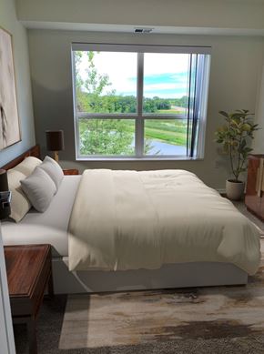 Waconia apartment for rent - a bedroom with a large window and a bed with white sheets