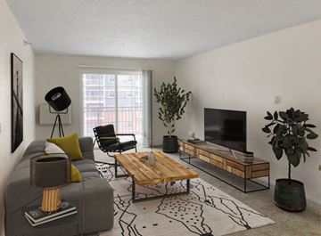 Rochester apartment for rent - a living room with a couch and a coffee table