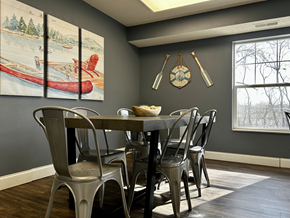 New Brighton apartment for rent - A dining room with a wooden table and chairs.