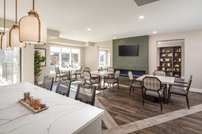 Oakdale apartment for rent - A modern dining room with a long table and chairs.