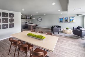 Newport apartment for rent - A modern dining room with a long table and chairs.