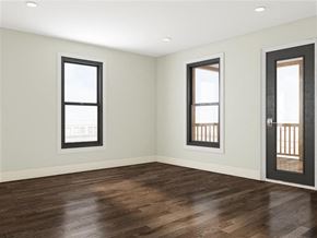Cambridge apartment for rent - an empty living room with wood floors and windows