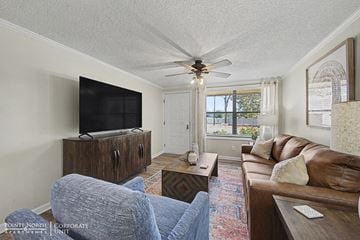 Albany apartment for rent - A living room with a brown couch and a flat screen TV.