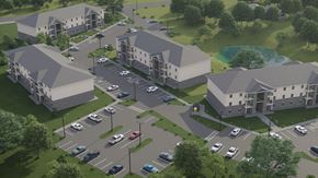 Shelbyville apartment for rent - A rendering of a residential complex with a parking lot in front.