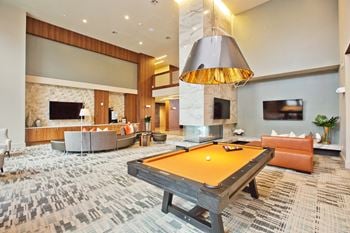 Game room w/ billiards, lounge & flatscreens