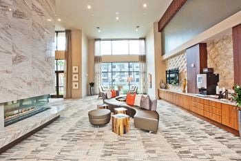 Resident clubroom w/ fireplace, lounge & coffee service