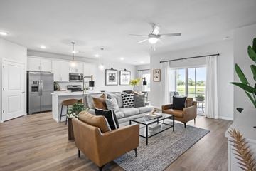 Beavercreek apartment for rent - A modern living room with a brown leather sofa and a glass coffee table.
