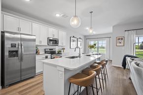 Asheville apartment for rent - A modern kitchen with a large island and stainless steel appliances.