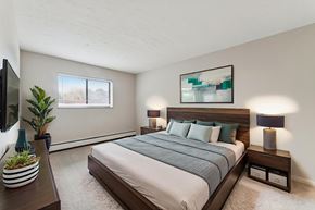 Rocky River apartment for rent - A bedroom with a large bed and a flat screen TV.