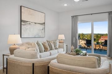 Sagamore Hills apartment for rent - a living room with a couch and chairs and a sliding glass door