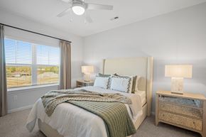 Sagamore Hills apartment for rent - a bedroom with a bed and a ceiling fan
