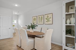 Sagamore Hills apartment for rent - a dining room with white chairs and a wooden table