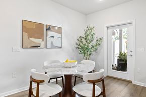Asheville apartment for rent - A dining room with a white table and chairs.