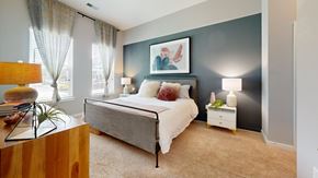 Chapel Hill apartment for rent - A bedroom with a bed, nightstand, and lamp.