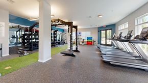 Chapel Hill apartment for rent - A gym with treadmills, weights, and exercise equipment.